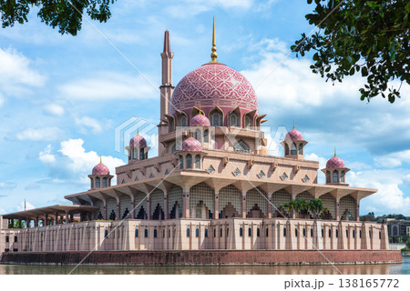 Putra Mosque iconic pink dome and minaret architecture on the waterfront in Putrajaya Malaysia under blue sky Putra Mosque iconic pink dome and minaret architecture on the waterfront in Putrajaya Malaysia under blue sky 138165772
