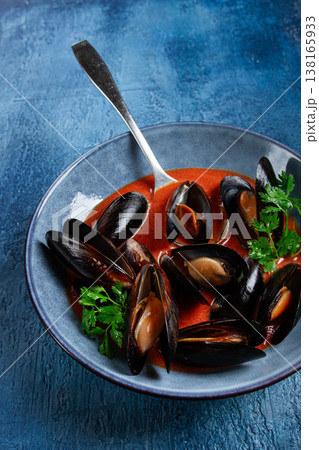 Fra Diavolo mussels, mussels in tomato sauce, Italian dish, on a blue background, homemade, no people, Fra Diavolo mussels, mussels in tomato sauce, Italian dish, on a blue background, homemade, no people, 138165933