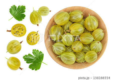 Green gooseberry in a wooden bowl isolated on white background . Top view. Flat lay. Green gooseberry in a wooden bowl isolated on white background . Top view. Flat lay. 138166554