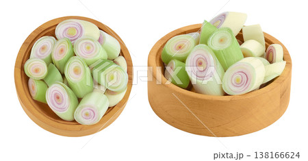 Fresh Lemongrass in wooden bowl isolated on white background . Top view. Flat lay Fresh Lemongrass in wooden bowl isolated on white background . Top view. Flat lay 138166624
