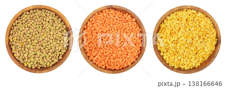 green red end yellow lentil in wooden bowl isolated on white background. Top view green red end yellow lentil in wooden bowl isolated on white background. Top view 138166646