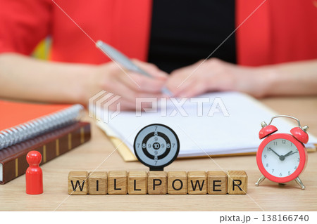 Exploring willpower with blocks and a clock in a focused workspace setting Exploring willpower with blocks and a clock in a focused workspace setting 138166740
