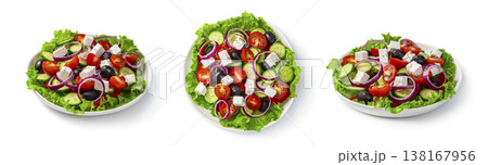 Greek salad in a flat plate close-up view from above and from the side isolated on a white background. Greek salad in a flat plate close-up view from above and from the side isolated on a white background. 138167956