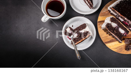 Chocolate cake slices with coffee on dark background top view Chocolate cake slices with coffee on dark background top view 138168167