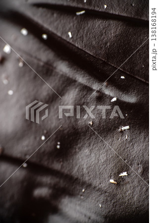 Chocolate glaze texture macro background with glossy dark surface Chocolate glaze texture macro background with glossy dark surface 138168194