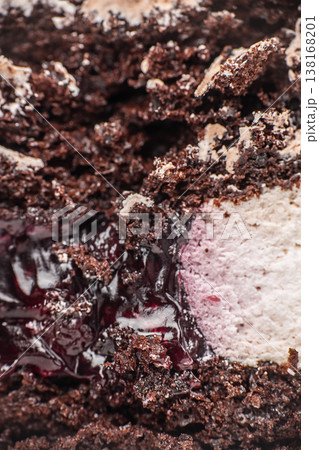 Chocolate cake filling macro with berry jam and cream texture 138168201