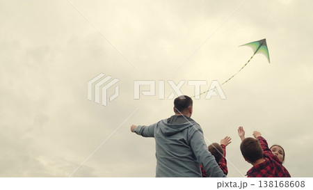 Dad and children launch kite, sibling fun in the meadow, father-son-daughter time, playful happiness, kite soaring high, countryside adventure, laughter in the air, childhood dreams, wind and sky Dad and children launch kite, sibling fun in the meadow, father-son-daughter time, playful happiness, kite soaring high, countryside adventure, laughter in the air, childhood dreams, wind and sky 138168608