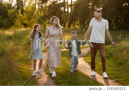 Excited Family Members Engage In Spontaneous Walk Amidst Vibrant And Cheerful Environment With Kids 138169121
