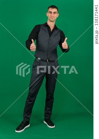 emotions of handsome man guy on a green background chromakey close-up dark hair young man emotions of handsome man guy on a green background chromakey close-up dark hair young man 138171441