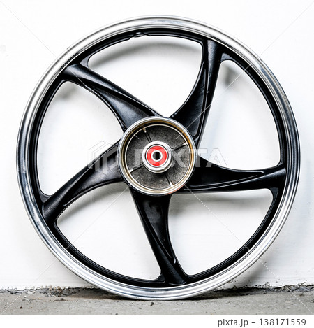 Black and silver motorcycle wheel rim cast alloy five spoke design isolated on white background for motorbike custom tuning and spare repair part Black and silver motorcycle wheel rim cast alloy five spoke design isolated on white background for motorbike custom tuning and spare repair part 138171559