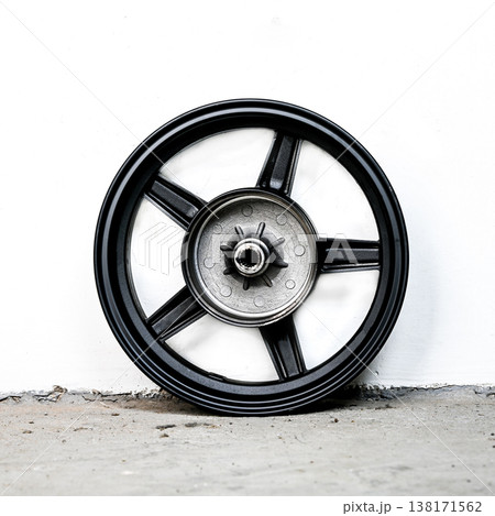 Black motorcycle wheel rim cast alloy five spoke design rear view with silver metal hub isolated on white background for motorbike repair and tuning Black motorcycle wheel rim cast alloy five spoke design rear view with silver metal hub isolated on white background for motorbike repair and tuning 138171562