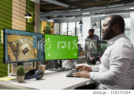 Green screen and architectural CAD software on dual monitors in creative agency, modern apartment floor plan. Professional developing a layout and 3D rendering of interior design in office. 138172164