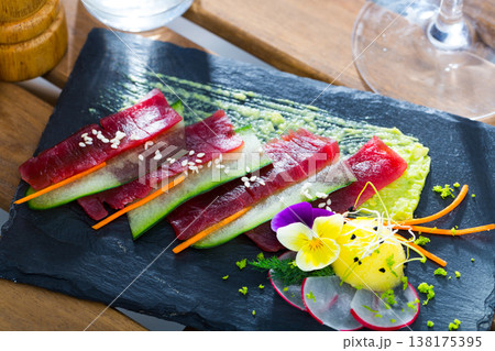 Raw tuna sashimi with cucumber and avocado sauce 138175395