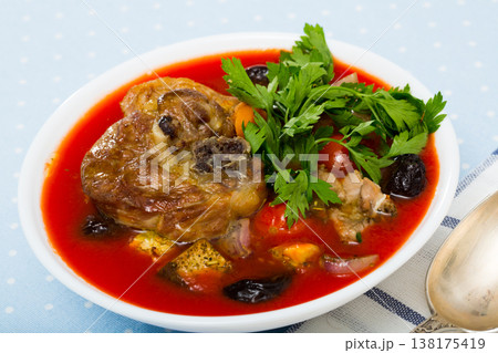 Spicy tomato soup with lamb, prunes and dried apricots Spicy tomato soup with lamb, prunes and dried apricots 138175419