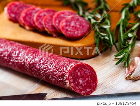 Sliced dry cured pork sausage Fuet Nobleza 138175454