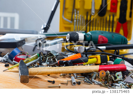 Table littered with various construction tools 138175465