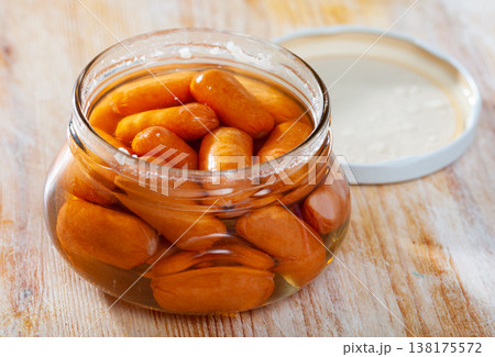 Open jar with preserved mini sausages Open jar with preserved mini sausages 138175572