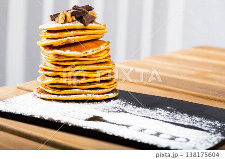 Stack of pancakes with chocolate 138175604