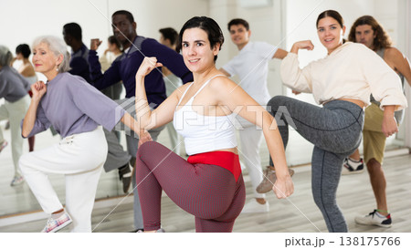 Young Hispanic woman practicing vigorous dance movements Young Hispanic woman practicing vigorous dance movements 138175766