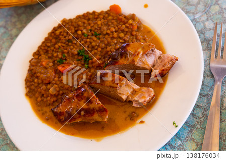 Delicious pork tenderloin with mousserons sauce and lentils 138176034