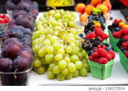 Fresh juicy grapes and plums at the market 138177014