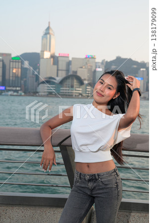 Smiling Thai Woman Tourist at Hong Kong Victoria Harbour Smiling Thai Woman Tourist at Hong Kong Victoria Harbour 138179099