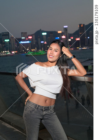 Thai Woman Tourist at Hong Kong Night Skyline 138179109