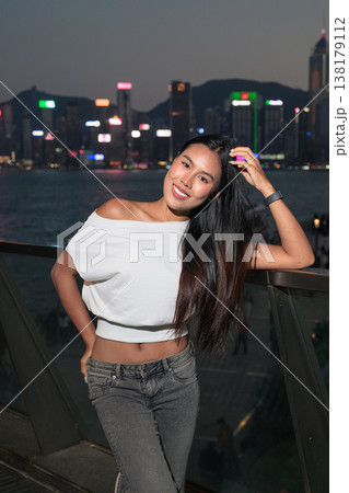Thai Woman Tourist at Hong Kong Night Skyline 138179112