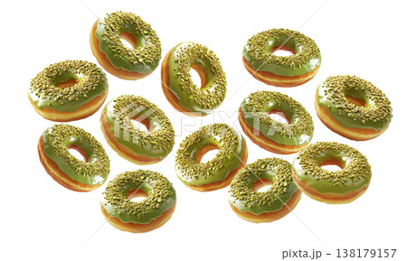 Multiple pistachio glazed donuts with crushed nuts isolated on a white background, concept of sweet bakery treats 138179157