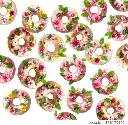 Decorative donuts topped with edible flowers, mint, and icing, isolated on white background, concept of floral dessert 138179161