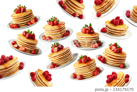 Multiple stacks of pancakes topped with strawberries and raspberries, isolated on white background, concept of breakfast variety Multiple stacks of pancakes topped with strawberries and raspberries, isolated on white background, concept of breakfast variety 138179170