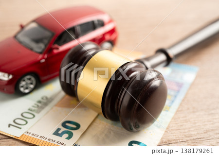 Hammer gavel judge and Euro banknote money with car vehicle accident, insurance coverage claim lawsuit court case. Hammer gavel judge and Euro banknote money with car vehicle accident, insurance coverage claim lawsuit court case. 138179261