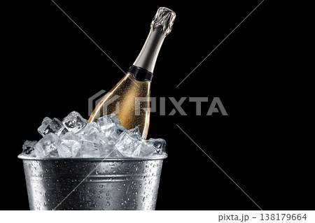 Champagne bottle in metal ice bucket, on black background with clipping path, concept of celebration Champagne bottle in metal ice bucket, on black background with clipping path, concept of celebration 138179664