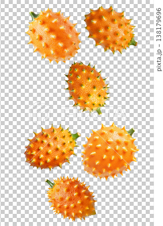 Multiple horned orange kiwano fruits with green tips isolated on white background, concept of exotic fruit freshness 138179696