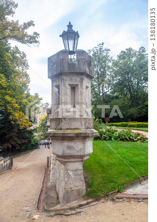 A historic stone lamppost in the castle park A historic stone lamppost in the castle park 138180135