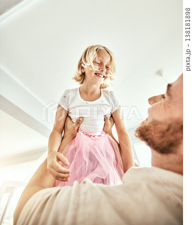 Family, kids and a father carrying his girl daughter in the living room of their home together closeup. Smile, love or children with a happy young kid and her man parent having fun in their house 138181898