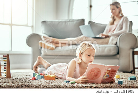 Child, floor and reading book for learning, language development and mother work from home in living room. Girl or kid with English story, education and relax on carpet with mom or family on sofa Child, floor and reading book for learning, language development and mother work from home in living room. Girl or kid with English story, education and relax on carpet with mom or family on sofa 138181909