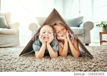 Portrait, children and cardboard for insurance with girl sisters on the floor of the living room at home. Security. family or kids and young siblings on a carpet in their house for safety with flare Portrait, children and cardboard for insurance with girl sisters on the floor of the living room at home. Security. family or kids and young siblings on a carpet in their house for safety with flare 138181929