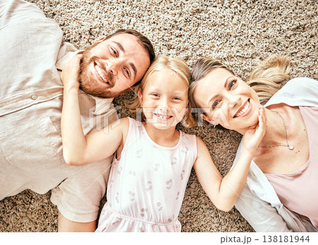 Happy, portrait and child with parents in the living room bonding and relaxing together at home. Happiness, love and girl kid laying with mother and father from Australia on floor in lounge at house. 138181944