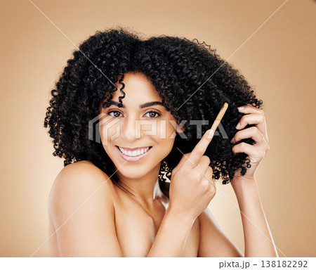 Afro, hair and brush with portrait of woman in studio for beauty, natural growth or coil texture on brown background. Happy model, curly haircare or comb tools of healthy treatment, aesthetic or care Afro, hair and brush with portrait of woman in studio for beauty, natural growth or coil texture on brown background. Happy model, curly haircare or comb tools of healthy treatment, aesthetic or care 138182292