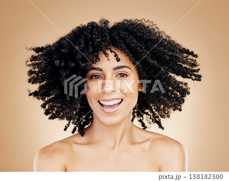 Model, curly and hair wind in afro fun on studio background for healthy hairstyle growth, texture or frizz treatment. African beauty woman, portrait and shake change by shampoo transformation results Model, curly and hair wind in afro fun on studio background for healthy hairstyle growth, texture or frizz treatment. African beauty woman, portrait and shake change by shampoo transformation results 138182300