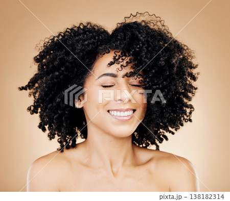 Woman, curly or wind in afro hair for fun on studio background in healthy hairstyle growth, texture or frizz treatment success. African beauty model, shake or change by shampoo transformation results 138182314