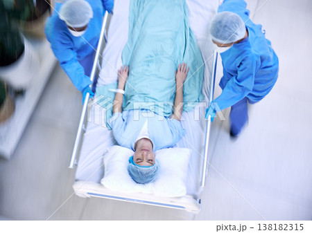 Doctors, team and hurry with bed in hospital for medical emergency, surgery operation or helping from above. Healthcare group running fast in rush, motion blur and urgent patient assessment in clinic 138182315