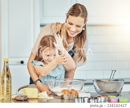 Mom, girl child and flour in kitchen, development and baking with bonding, love and care in family house. Cooking, mother and daughter with smile, teaching and eggs on table, dust and help for food Mom, girl child and flour in kitchen, development and baking with bonding, love and care in family house. Cooking, mother and daughter with smile, teaching and eggs on table, dust and help for food 138182427