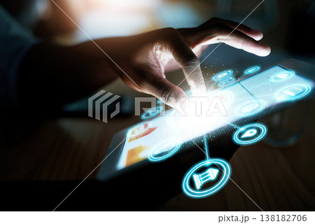 Person, hand and tablet at night with hologram, UI or 3D HUD and dashboard with icons on desk at office. Closeup of employee working late on technology in digital marketing or networking at workplace Person, hand and tablet at night with hologram, UI or 3D HUD and dashboard with icons on desk at office. Closeup of employee working late on technology in digital marketing or networking at workplace 138182706
