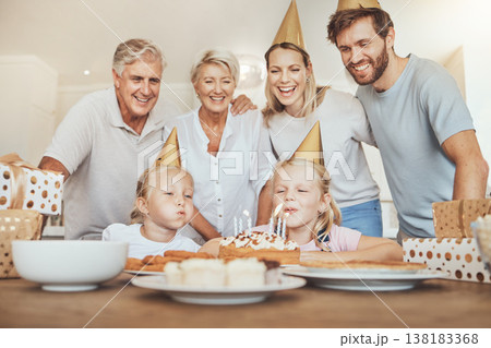 Parents, grandparents and children with candles on birthday cake for celebration with family, love and sweets in home. Happiness, men and women together at table at girl kids party event in apartment 138183368