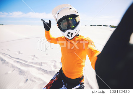 Motorbike, man and posing for selfie in desert for race challenge, freedom and wellness in action. Athlete, fast and adrenaline in extreme sports, fitness and energy for competition on dirt bike Motorbike, man and posing for selfie in desert for race challenge, freedom and wellness in action. Athlete, fast and adrenaline in extreme sports, fitness and energy for competition on dirt bike 138183420