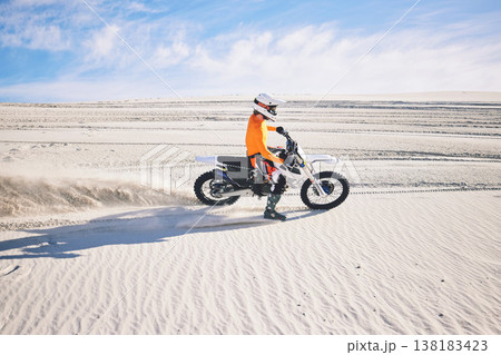 Desert dust, motorbike and man outdoor for extreme sports, adventure and travel. Off road, sand and driver on motorcycle on dirt track in nature for action, competition race and riding for freedom Desert dust, motorbike and man outdoor for extreme sports, adventure and travel. Off road, sand and driver on motorcycle on dirt track in nature for action, competition race and riding for freedom 138183423