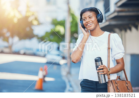 Black woman, work commute and music in city with work travel, headphones and morning with smile. Happy, female professional and employee in a street outdoor with confidence and web audio in town 138183521