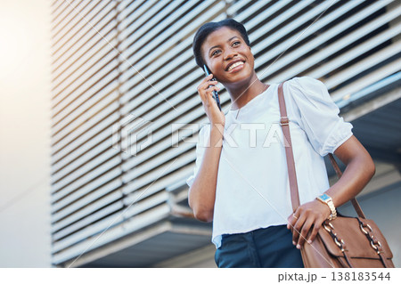 Phone call, walking and young woman in city with communication, discussion or networking. Happy, technology and African female person on mobile conversation with cellphone commuting in town street. 138183544